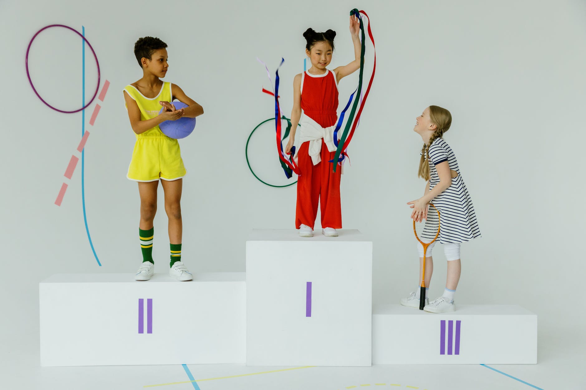 girls standing on an olympic podium stand